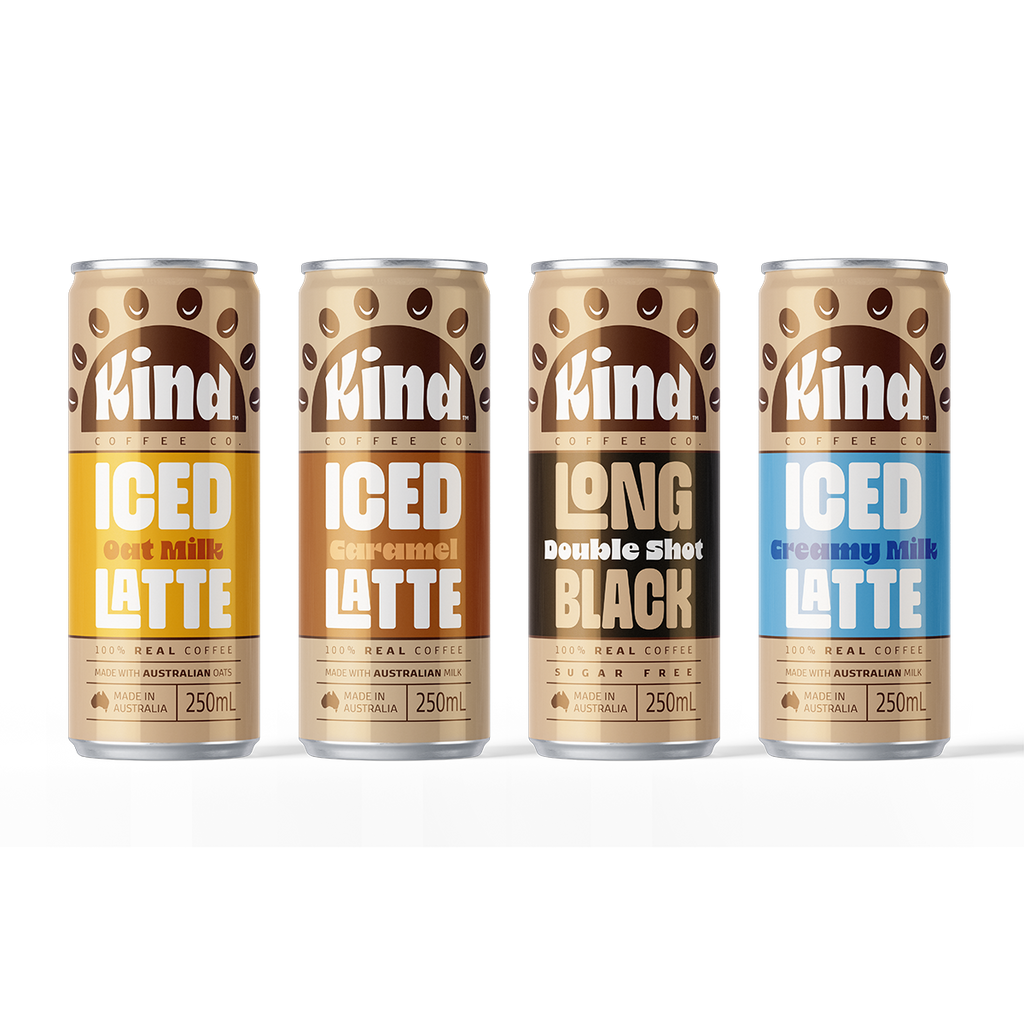 Four cans of Kind coffee drinks on a white background